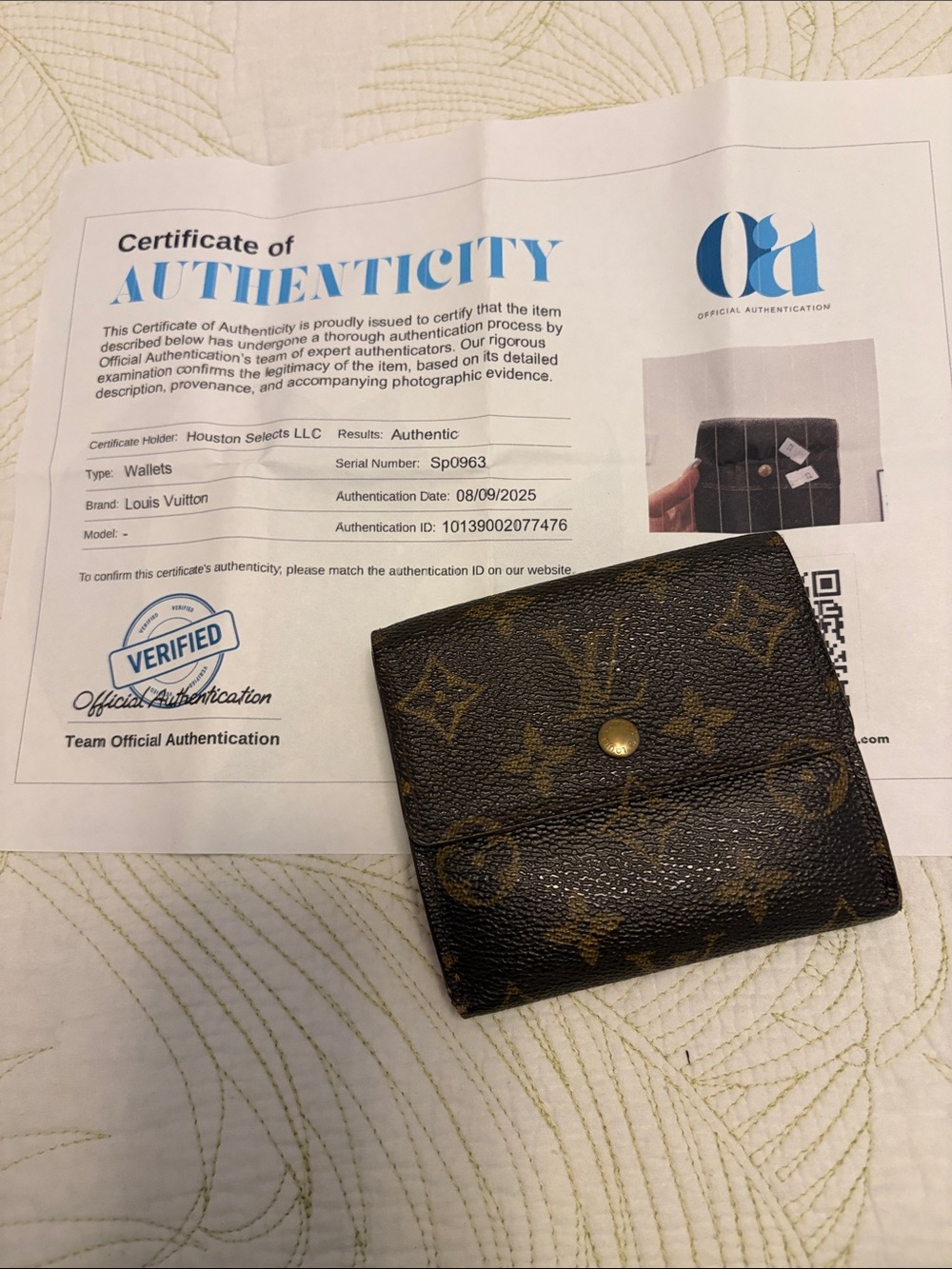Louis Vuitton trifold snap wallet. Authentication provided.